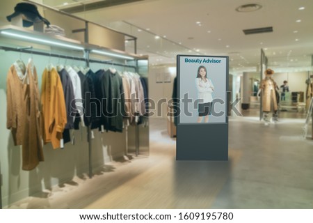 iot smart retail futuristic technology concept, smart Digital Signage display with virtual or augmented reality in the shop or retail advice to choose select ,buy cloths and give a rating of products 