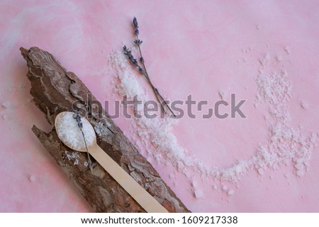 Natural wellness beauty ingredients on pink background. Health care spa therapy with sea salt and lavender,  super food for the skin
