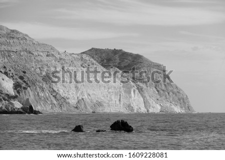 Seascape with Petra tou Romiou, also known as Aphrodite's Rock, is a sea stack in Pafos(Paphos), Cyprus. Aphrodites birthplace. Black and white.