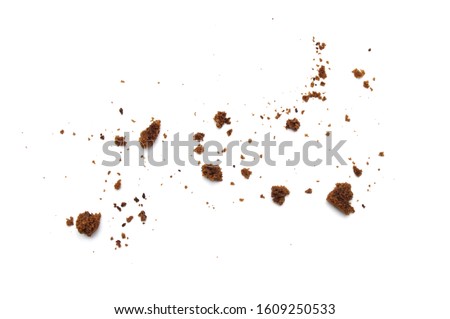 Scattered crumbs of chocolate chip cookies isolated on white background. Royalty-Free Stock Photo #1609250533