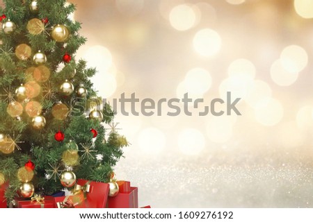 Christmas tree decorated on abstract background