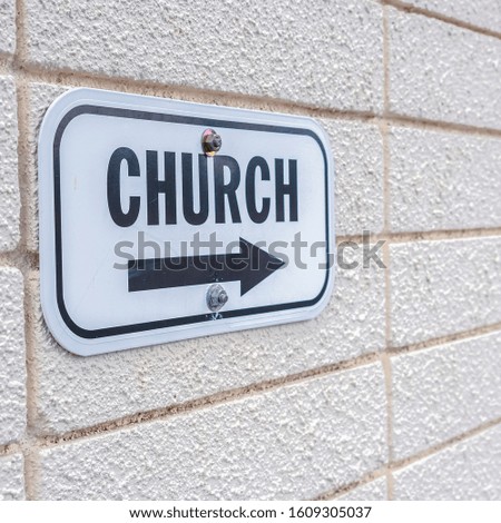 Square frame Church sign pointing to the right mounted on wall