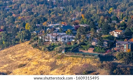 Panorama Suburban properties on a mountain slope on a sunny day