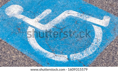 Panorama frame Disabled or Handicapped street sign on a cloudy day
