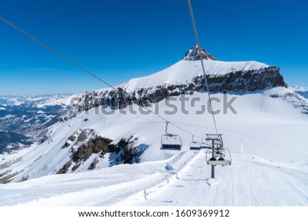 The Ice Flyer chairlift at Mount Titlis. Mount Titlis is a mountain of the Uri Alps at 3,238 metres above sea level.