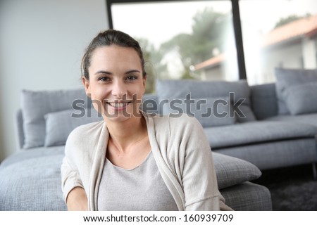 Portrait of 30-year-old woman relaxing at home Royalty-Free Stock Photo #160939709