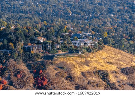 Suburban properties on a mountain slope on a sunny day