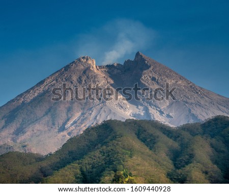 The splendor of the peak of Mount Merapi with a large fracture on the south side