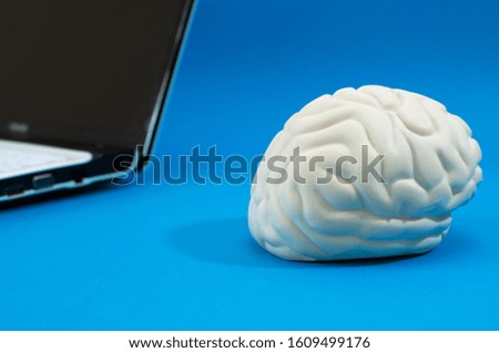 artificial brain and a laptop, the concept of artificial intelligence