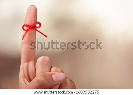 Index finger tied with rope, Reminder concept Royalty-Free Stock Photo #1609532275