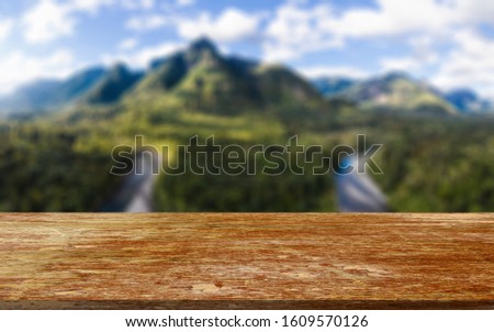 Empty wooden table with nature background