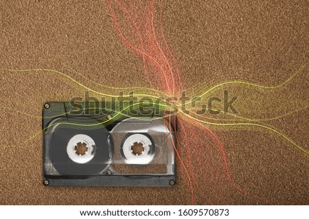 Vintage music cassette tape on texture background.