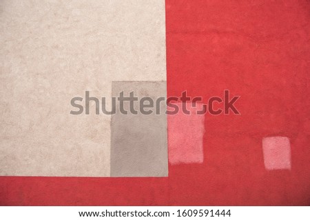 abstract square images on the wall in white and red