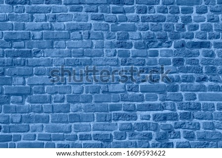 Blue Brick wall background. Texture of a brick wall. Modern wallpaper design for web or graphic art projects. Abstract background for business cards and covers. Template or mock up.