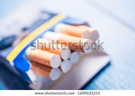 Close up of a smoking cigarettes. Pack of cigarette