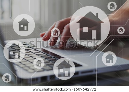 Real estate concept. Houses on schema diagram. Person search, compare and select proper rent apartment in laptop.