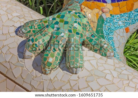 Lizard pad mosaic sculpture in Park Guell, Spain, Barcelona. Ceramic tile broken glass decoration 