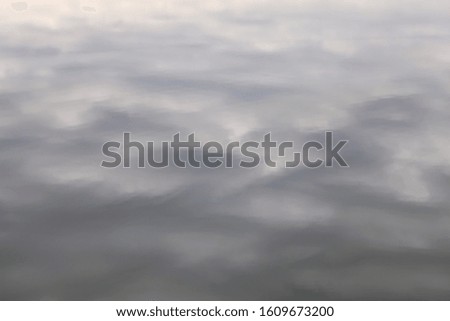 Abstract background - Reflection of cloudy, neutral sky in the water surface patterns with dark and shiny patches