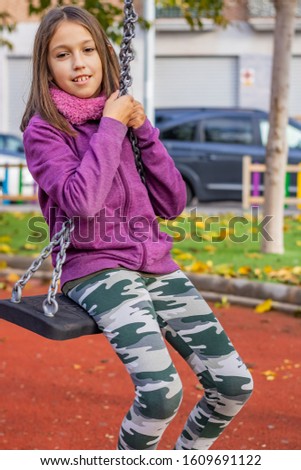Little girl posing in the village park