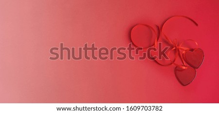 Two red hearts on red gradient background. Monochromatic effect. Love and Saint valentine Day modern concept. Copy space 