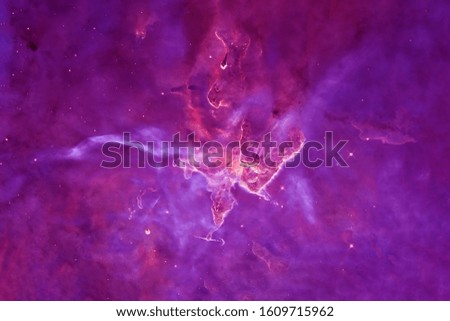 Violet nebula with unusual dense clouds. Elements of this image were furnished by NASA