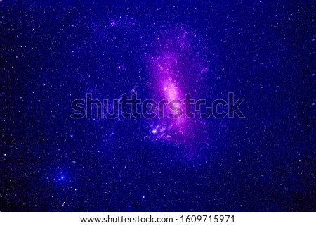 A blue nebula with many stars, and galaxies. Elements of this image were furnished by NASA