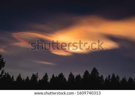 Stock photograph of polar stratospheric cloud captured in Norway Royalty-Free Stock Photo #1609740313