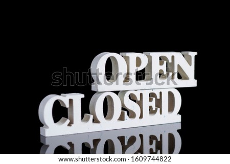 Open and closed sign board made from wooden. Isolated black background of sign board. Commercial concept picture. wooden sculpture of closed sign.