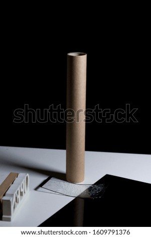 Paper towel. Black background. Empty paper tissue tube. Toilet paper rolls.