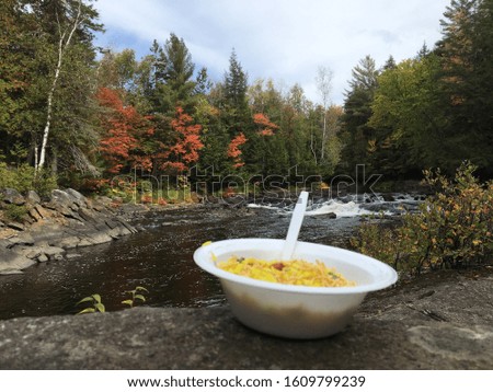 Indian breakfast “Poha” in front flowing water and waterfall downhill- one of the memorable day. Picture captured in Algonquin Park