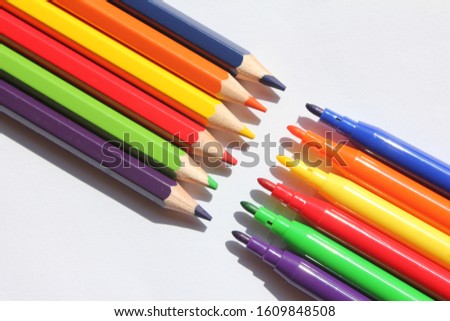 Color pencils and color markers for coloring pictures. isolated background.