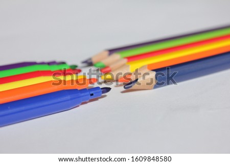 Color pencils and color markers for coloring pictures. isolated background.