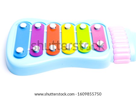 A high key picture of toy xylophone on white background. Music helps to stimulate baby reaction and good for brain.