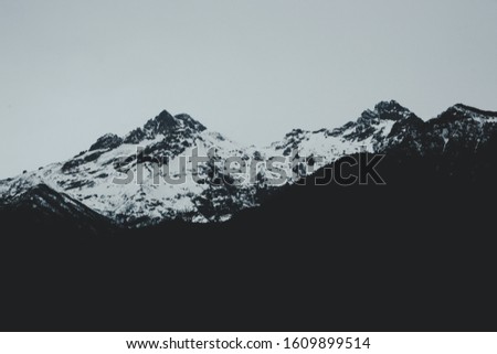 Beautiful mountain with snow on a rainy day.