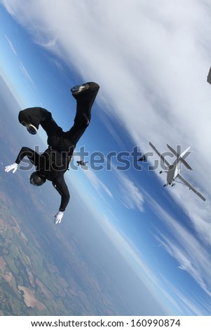 skydiving one man exit the plane, freedom concept