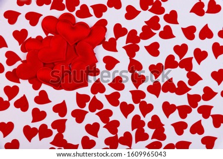 Background of small red hearts on a white background