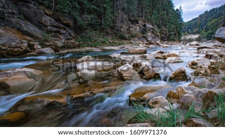 Boiling water of a mountain river in the mountains in summer