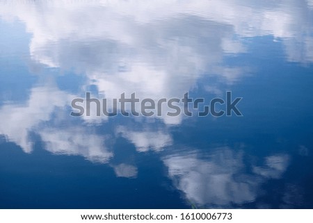The reflection of the clouds on the water