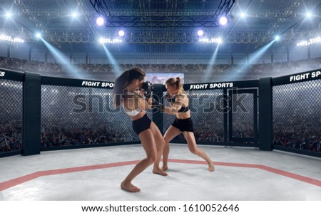 MMA female fighters on professional ring.