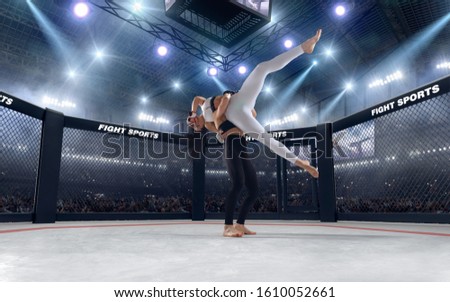 MMA female fighters on professional ring.