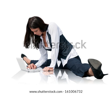 Young business woman in gymnastics pose working with computer - isolated on white