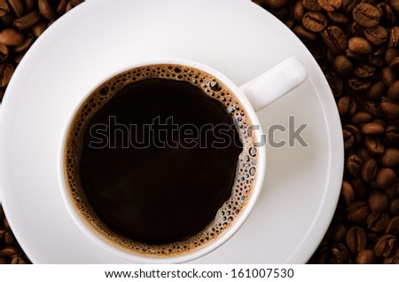 coffee cup with roasted beans