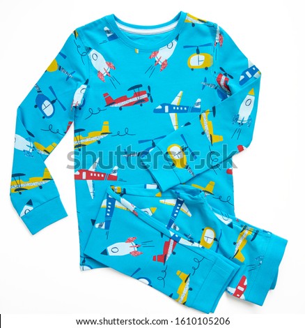 Sleepwear set for a toddler boy on white background. Shirt and pants made of blue pattern cotton fabric. Pajama for boy. Flat lay. Top view.  Royalty-Free Stock Photo #1610105206