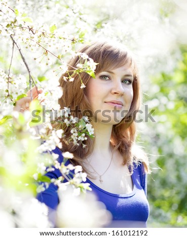 Smiling girl in  spring garden