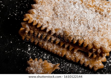 Carnival fritters topped with icing sugar, a typical Italian sweet of Carnival celebrations.