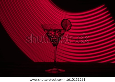 Neon martini glass shot with long exposure