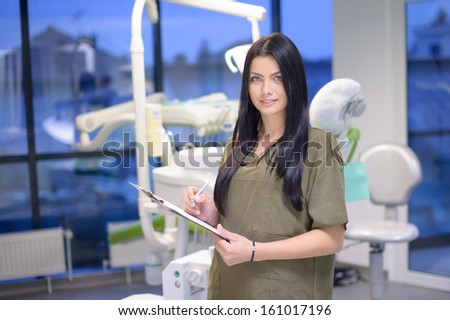 Charismatic assistant welcomes the patient