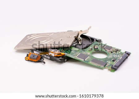 Memory storage device. Broken hard drive, (HDD). White background, close-up.