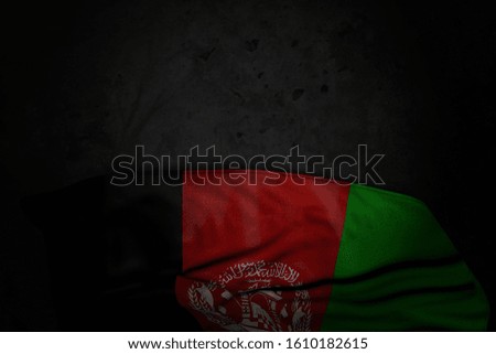 cute dark image of Afghanistan flag with big folds on black stone with empty place for content - any feast flag 3d illustration
