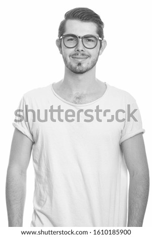 Portrait of young handsome bearded man in black and white